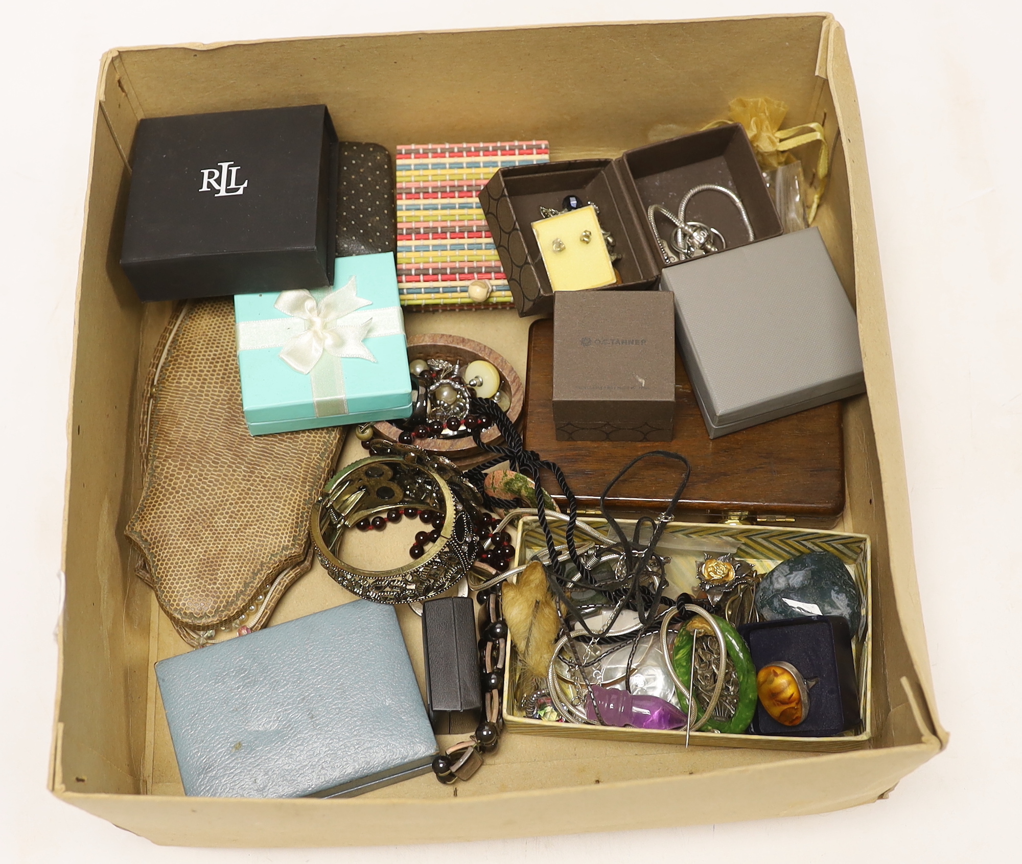 A group of assorted costume jewellery including a garnet necklace, amethyst pendant, etc.